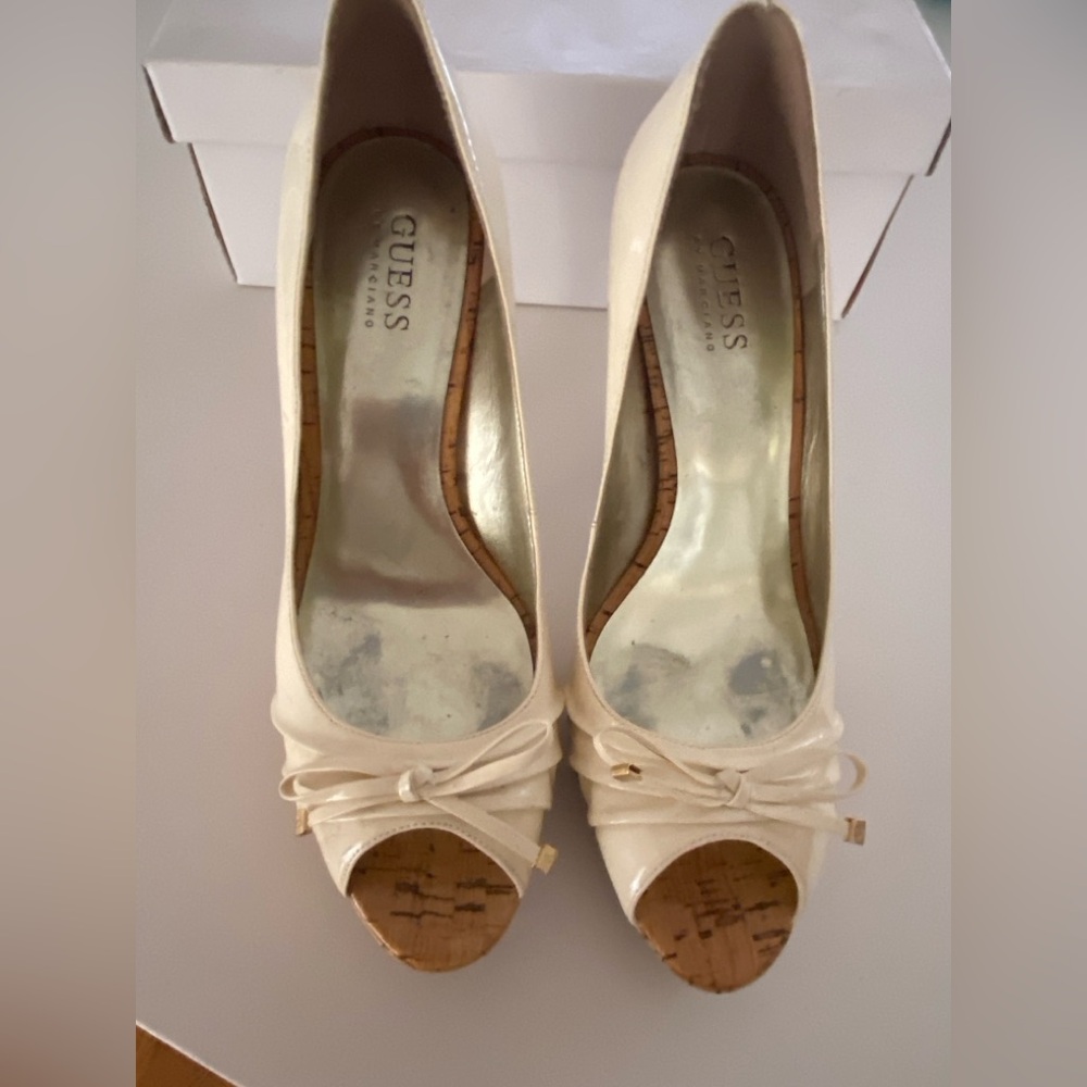 Guess,used high heels-off white, patent leather with a glazed cork base, 7.5.